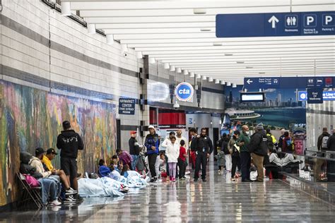 Hundreds of migrants sleep each night at the San Diego airport before flights